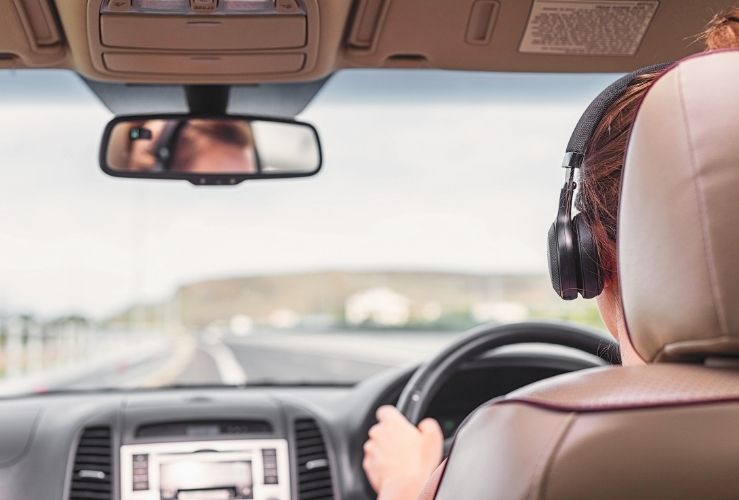 Driving a car whilst wearing headphones