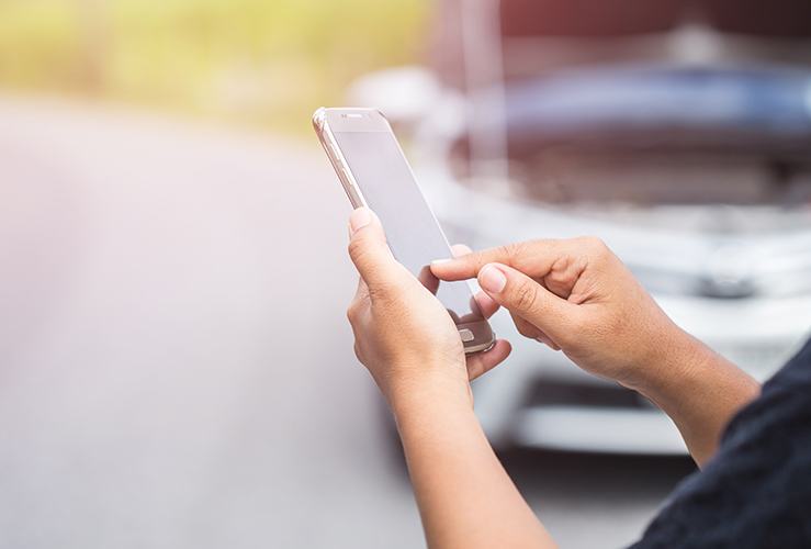 Phone call in front of broken down car