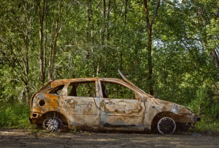 Abandoned car in forest