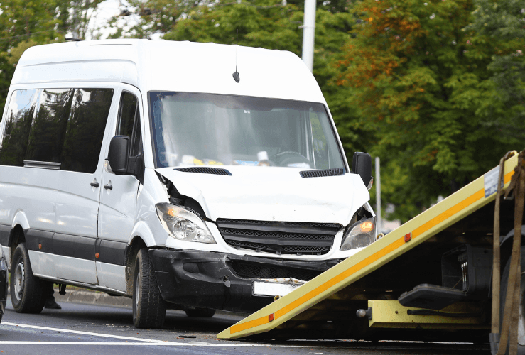 Crashed mini bus being recovered